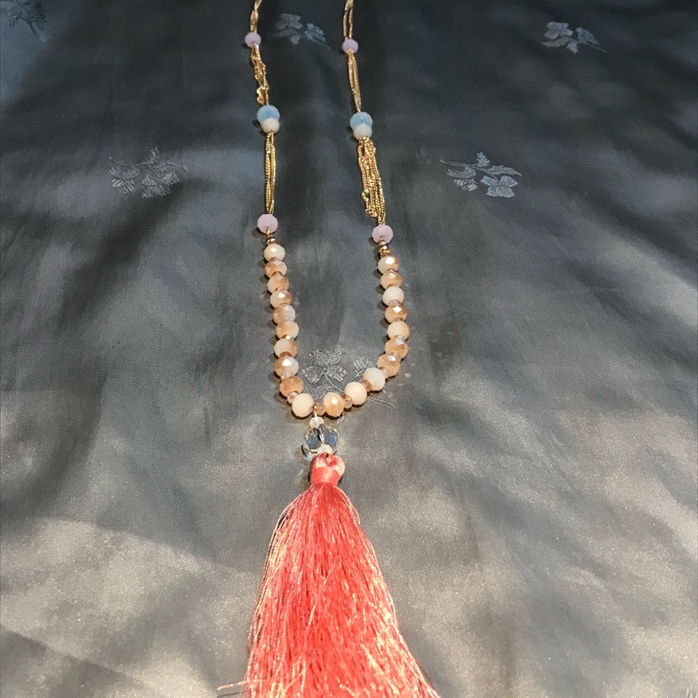Coral colored tassel w/iridescent beads goldtone